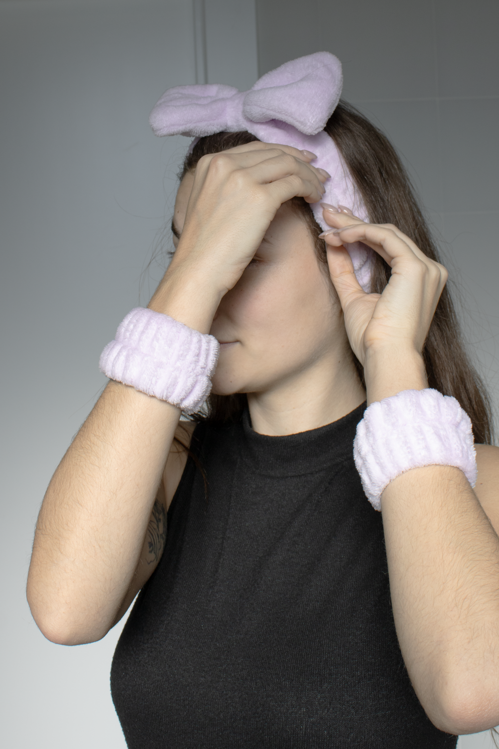 Model with pink headband and bracelet