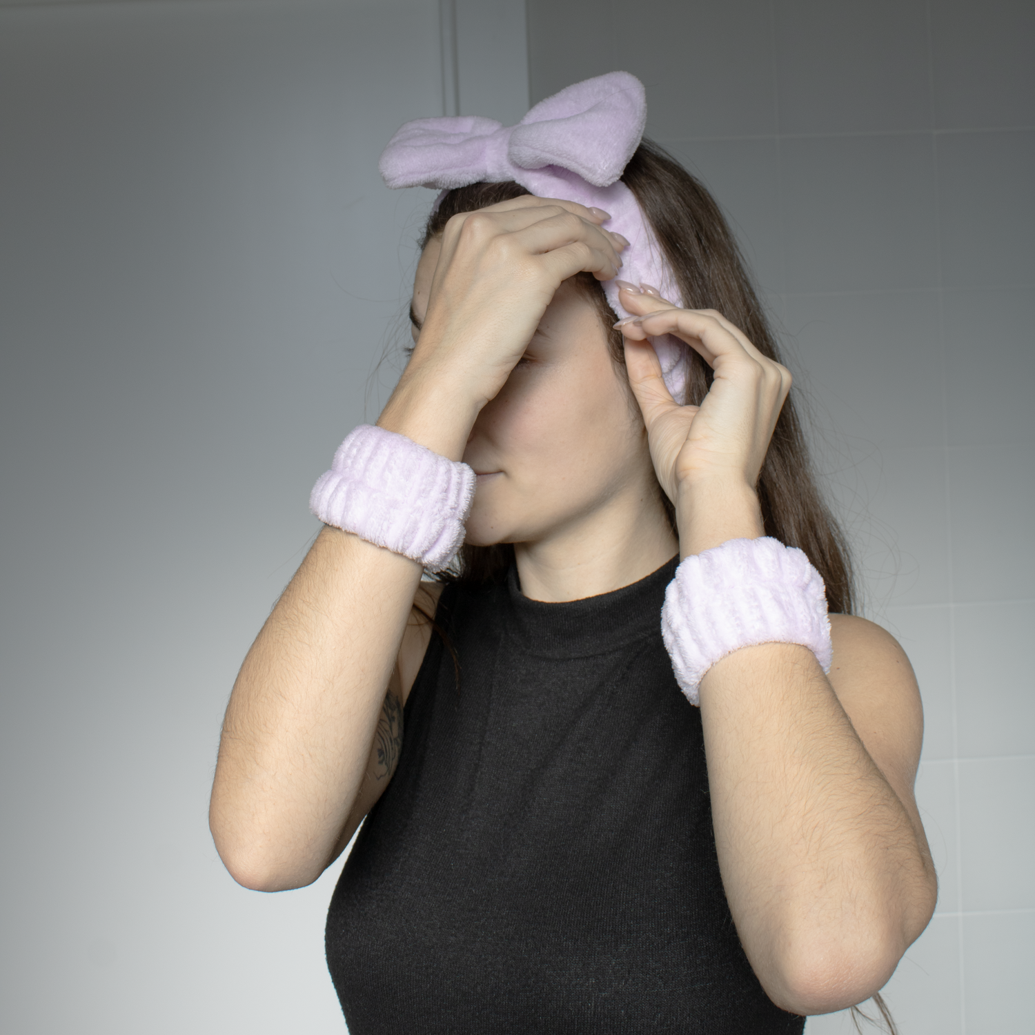 Model with pink headband and bracelet