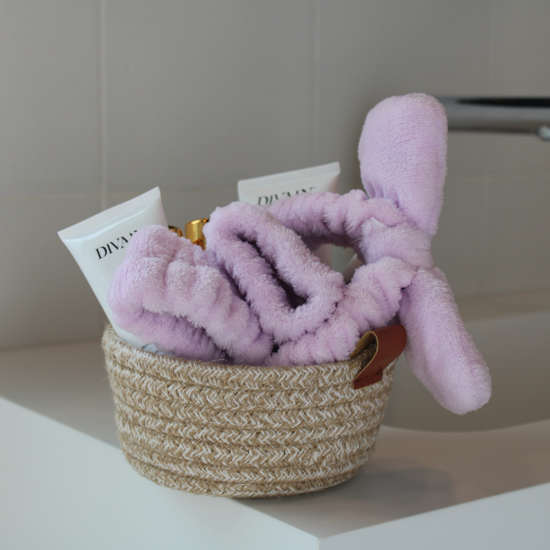 Pink headband and bracelet set in a basket